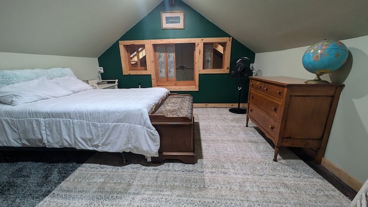 Upstairs bedroom (to the right) is in the center of the house! This room is  a family favorite. Its cozy and warm in the winter and airy in the spring/winter/fall. Its fun for kids to look down into the living room! 