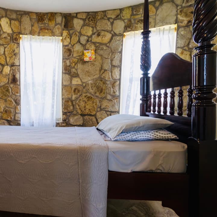 Bedroom #3 | Second Floor...
A charming and cozy room featuring a full/double-size locally made bed, providing a comfortable and restful space on the second floor. Perfect for a relaxing stay with a touch of local craftsmanship.