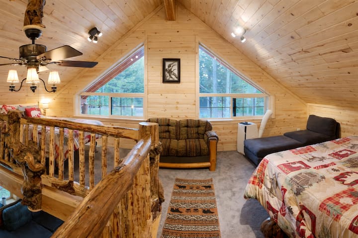 The loft upstairs has two queen sized beds and large windows to let in lots of natural light. 