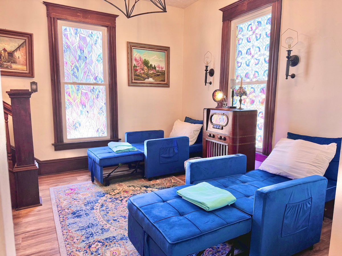 Chairs that double as beds—because sometimes, even your furniture needs to multitask! This is a parlor room, and opens up to living room area. 