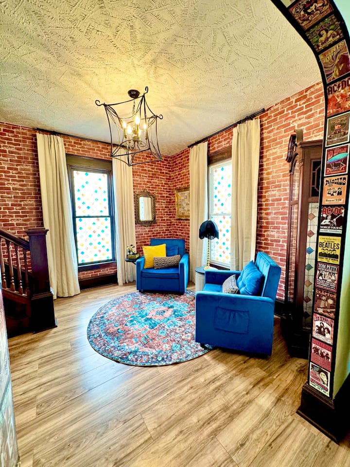 Chairs that double as beds—because sometimes, even your furniture needs to multitask! This is a parlor room, and opens up to living room area.