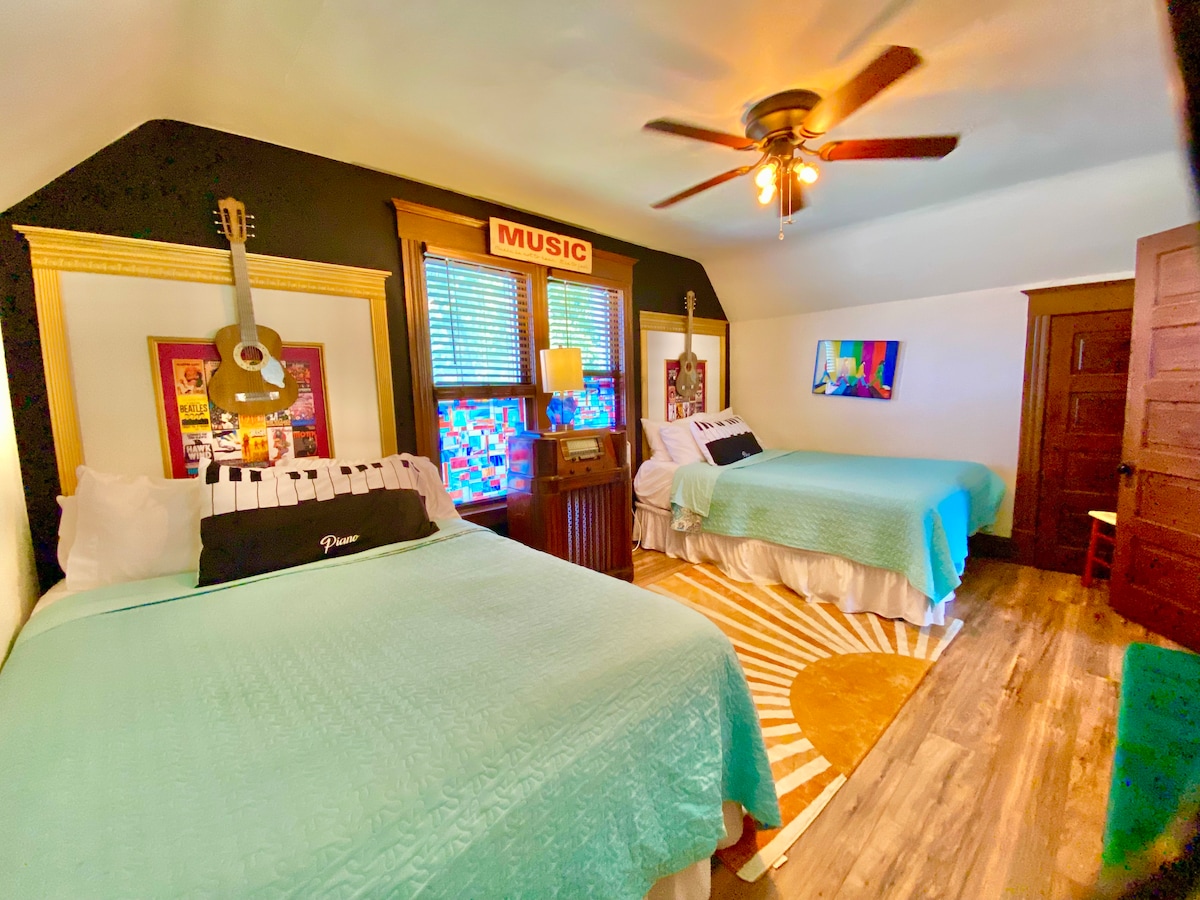Rock out in our music-themed bedroom! With two queen beds, you'll have plenty of space to practice your air guitar and compose sweet dreams.
