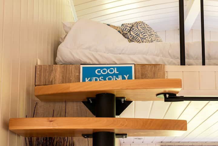 The upstairs den is pure kids' territory, even with a push along buggy for the ride.