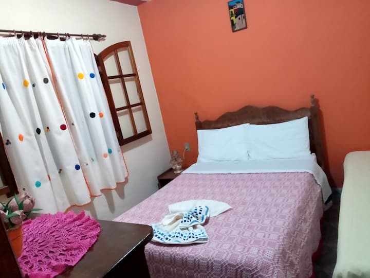 This room has a double bed and a single bed, a dresser and a mirror!