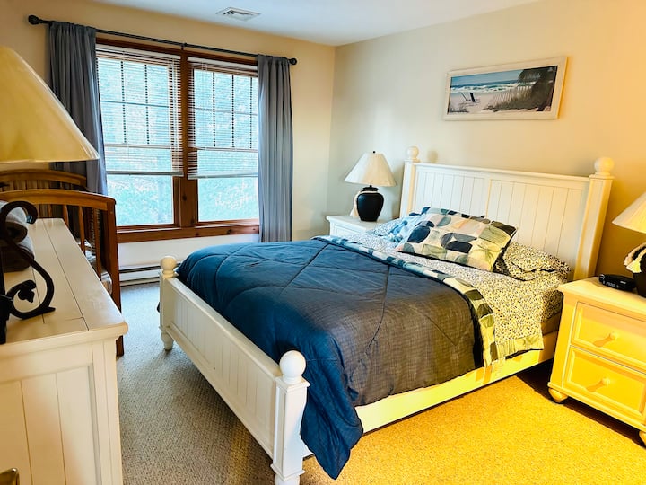 Master Bedroom with Queen bed and a crib is located on the second floor and is adjoined to the bathroom.