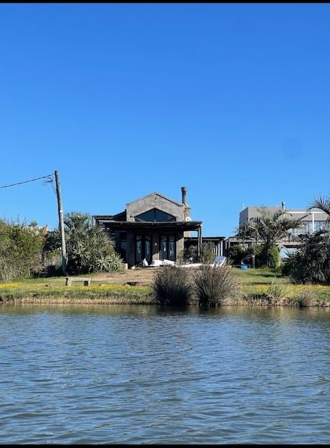 Enjoy the wood-burning stove while looking at the lagoon
