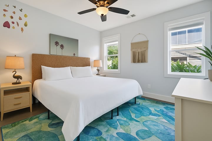The master suite is conveniently located on the first floor off of the kitchen area. It includes a walk in closet, full bathroom, and bedroom with king sized bed.