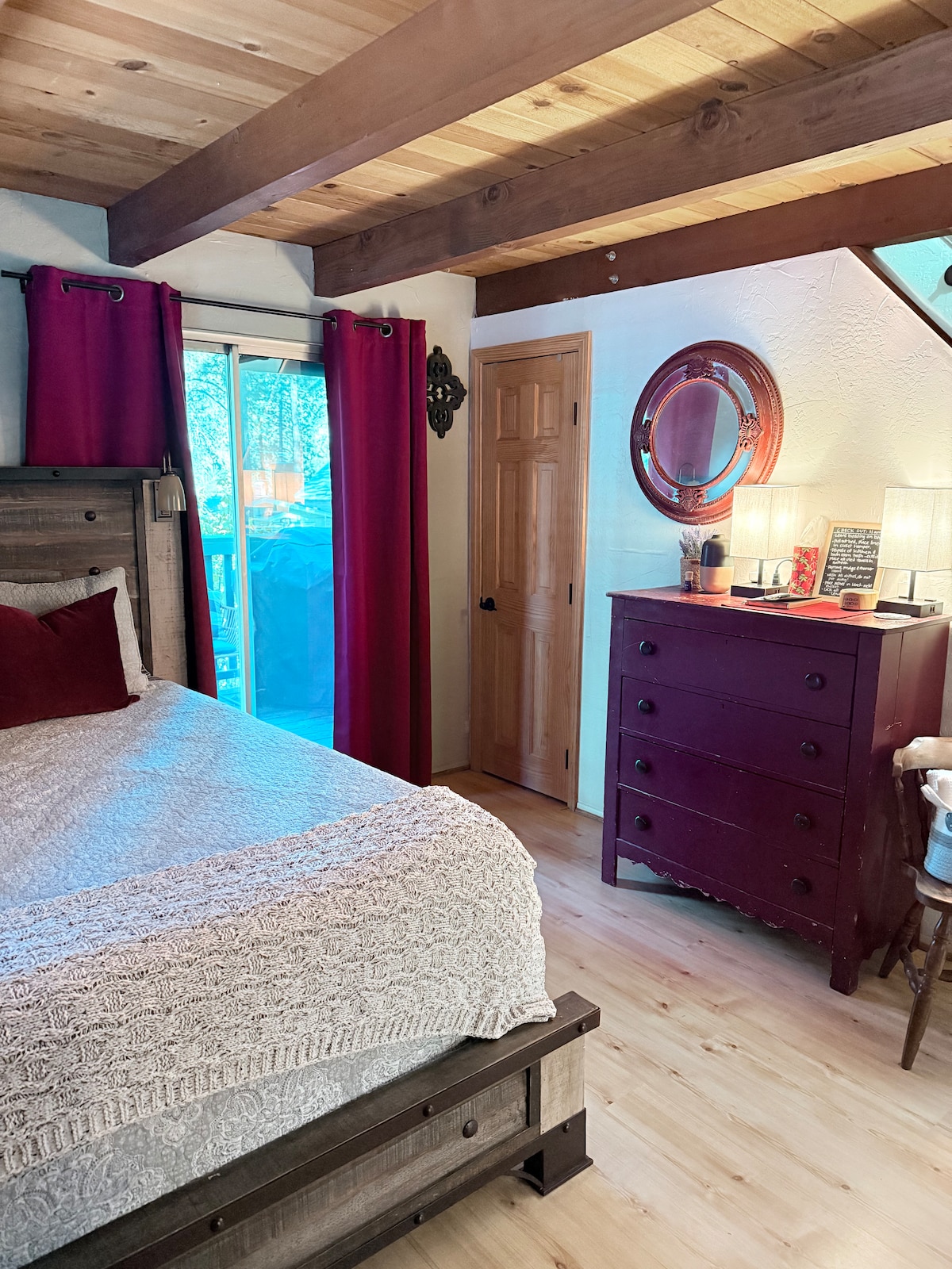 Spacious bedroom with Queen gel mattress. This room opens up to the front deck 