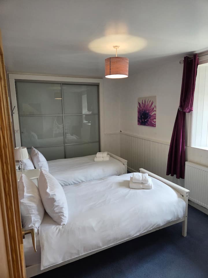 Bedroom 1 has 2 single beds and is located on the ground floor