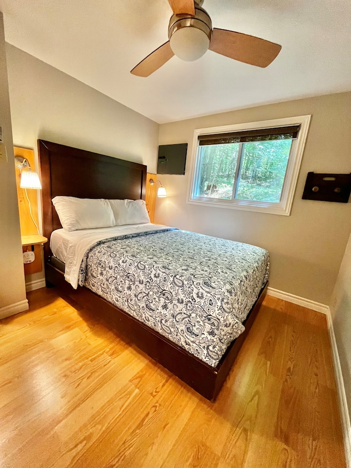 Lots of power plugs for devices, including USB and USB-C power. Lighting on each side of bed, individually controlled; dresser for clothes storage, hooks for towels/clothes.