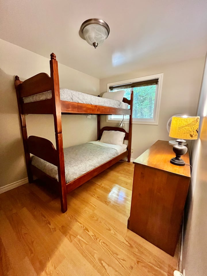 Dresser for clothing storage; lights under the bunk; hooks to hang towels; Washer/dryer is in this room.