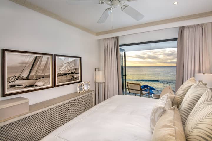 Bedroom 3 with a king size bed (US), ensuite shower room, security safe, air conditioning, bath robes, hair dryer and a balcony with sea views.