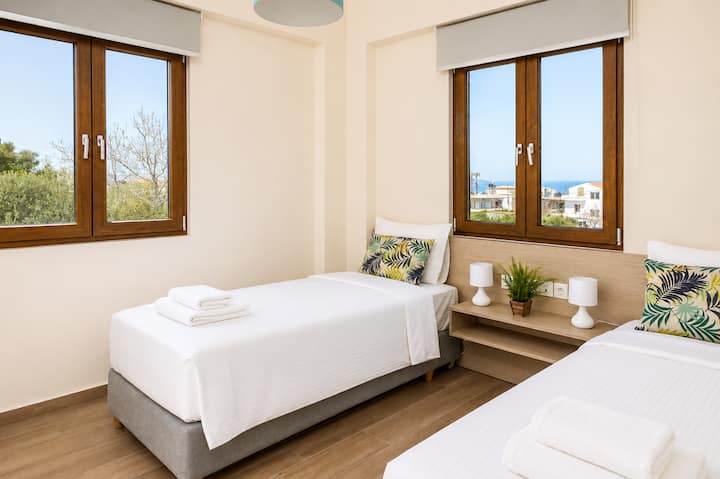 First floor - Bedroom 4 with two single beds and ensuite bathroom