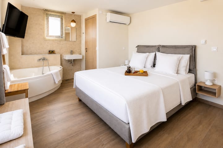 Second floor - Master Bedroom 2 with queen bed, ensuite bathroom with jacuzzi bath and panoramic views