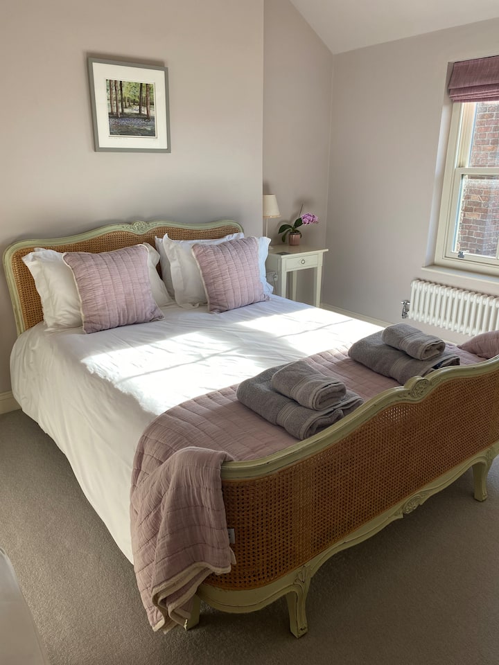 Master Bedroom with King size French bed, full wardrobe, 2 bedside tables, chair and chest of drawers.  There is plenty of room for a travel cot, in fact we have set up two cots for twin babies.  Two travels can be provided free of charge.  