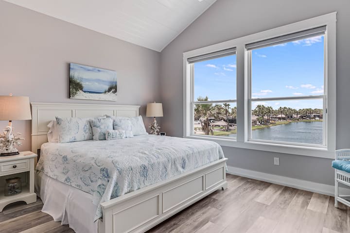 Wake up to stunning waterfront views from your comfortable bed, where coastal-themed décor creates a serene retreat.