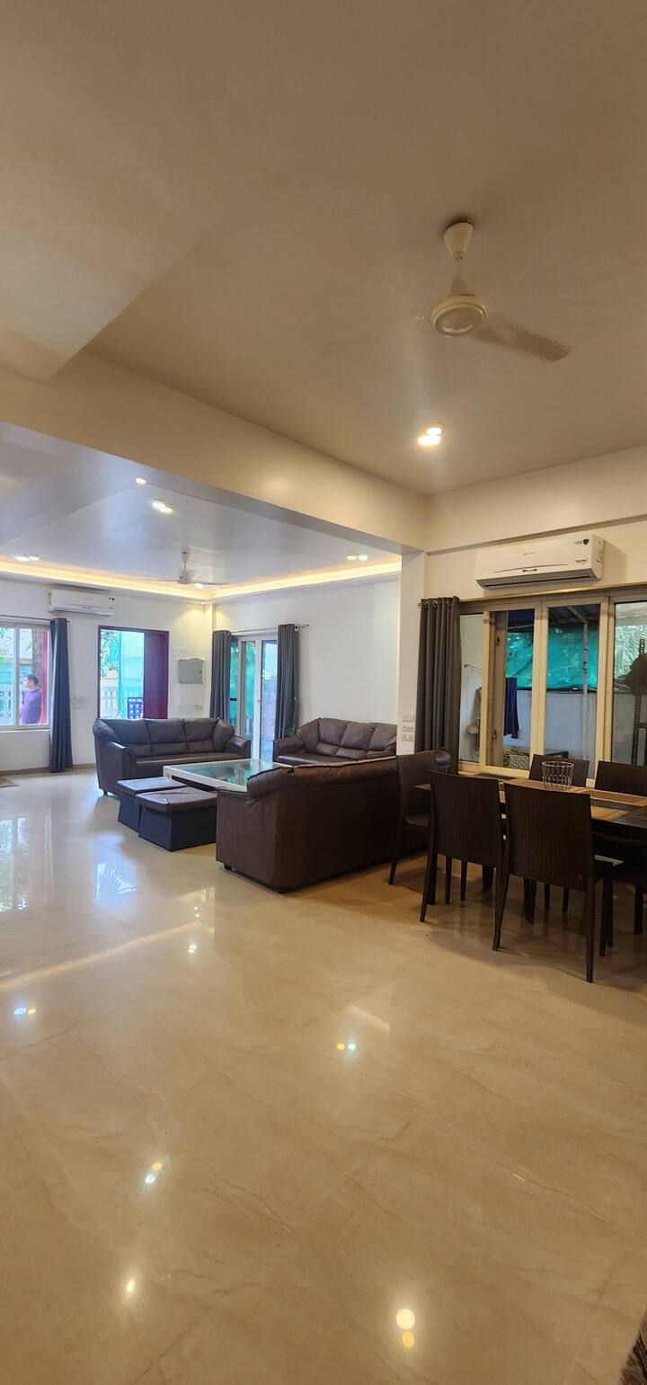 Spacious living room comfortable for up to 10 guests. Create your own party area