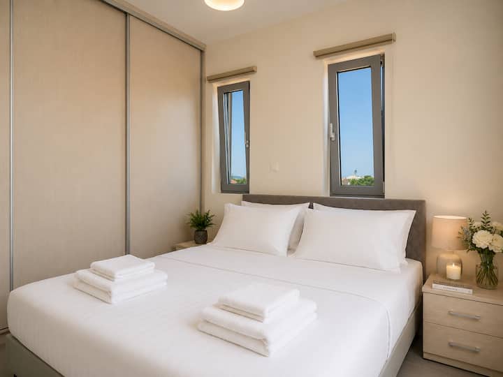 Upper Level - Bedroom 1 with queen bed, private balcony & breathtaking sea views