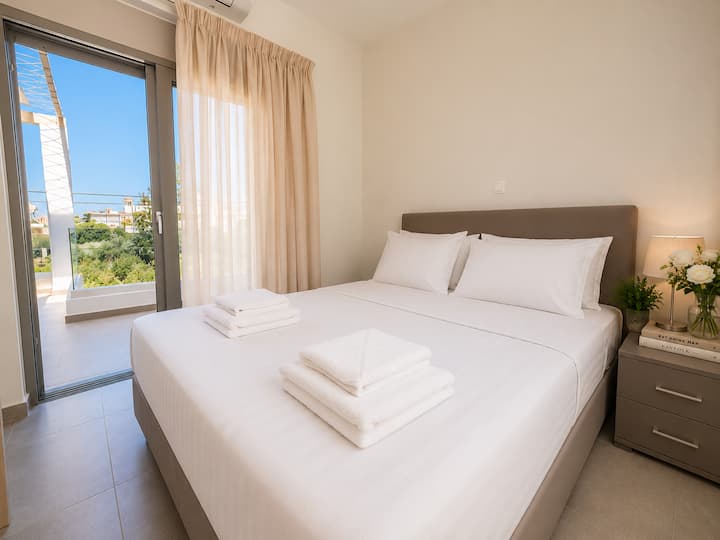 Upper Level - Bedroom 2 with queen bed, private balcony & breathtaking sea views