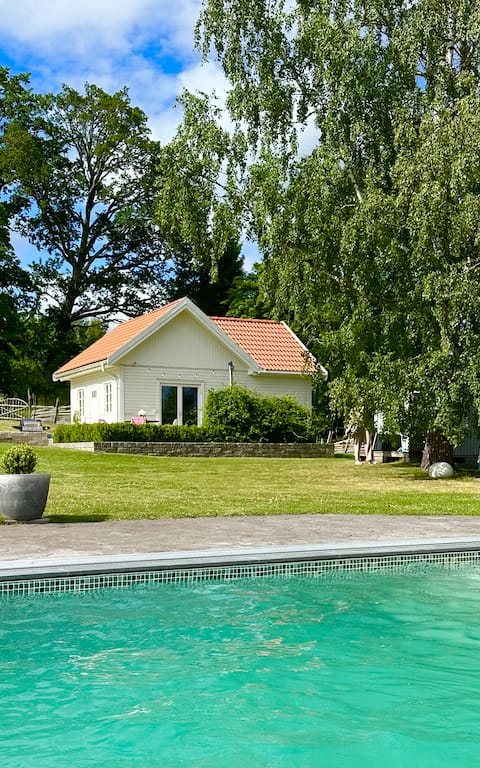 Small cabin on horse farm with pool.
