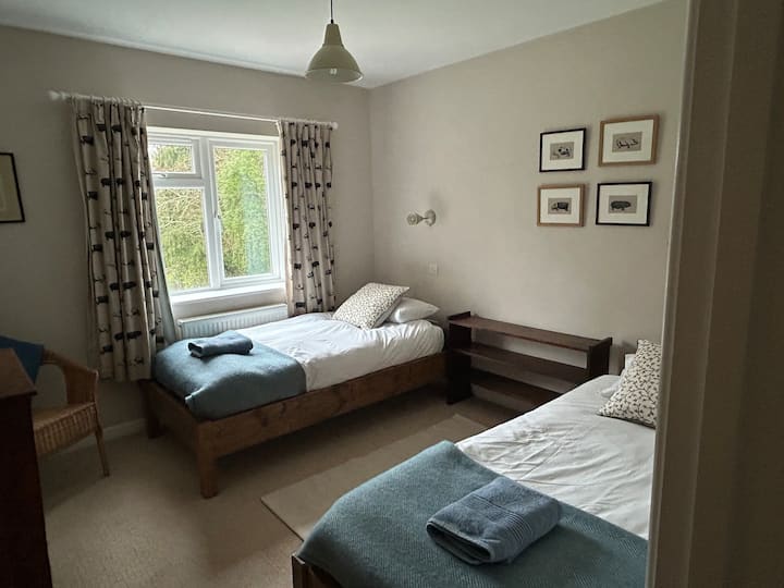 Two single beds, chest of drawers, views over the large back garden 
