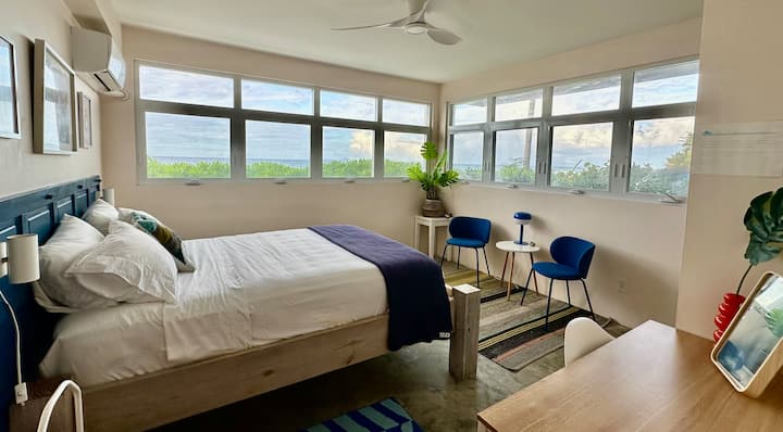 Corner queen bedroom with panoramic ocean views