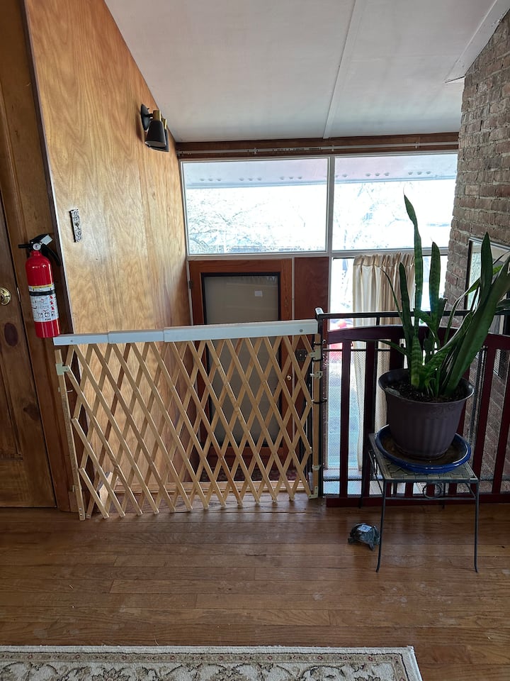 A safety gate at the top of the steps can keep kids and pet in the apartment