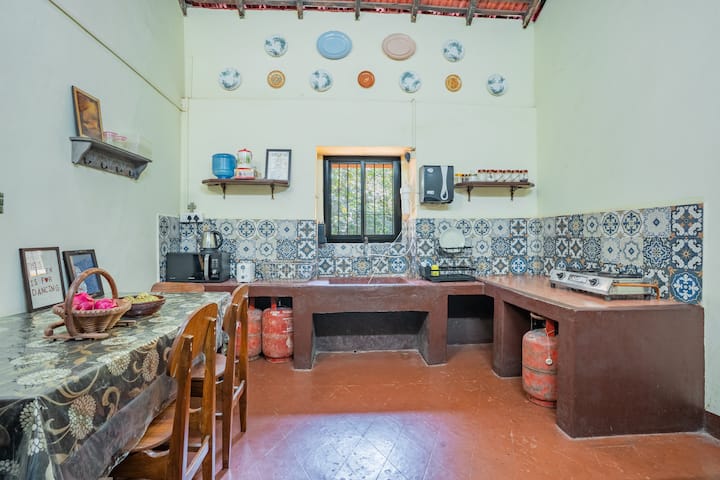 The kitchen is fully functional, it has a gas range, fridge, microwave, kettle, toaster and cutlery!