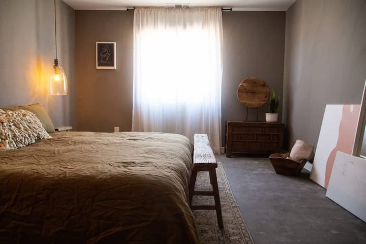 The moody master bedroom with en suite bathroom