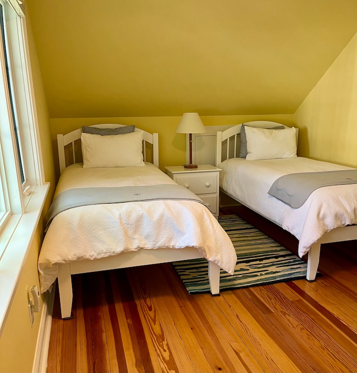 Twin beds in the Yellow Room.