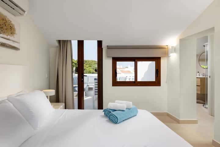 Bedroom 2 on the second floor with views onto its private terrace. This bedroom has a queen sized bed and en-suite bathroom.