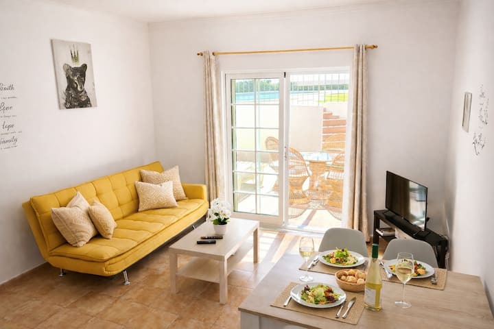 Living room with sofa bed convertible to 2 beds, fiber broadband wifi (500 mbps), cable TV channels giving access to the terrace and pool