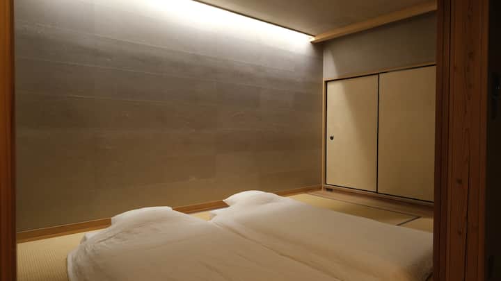 The bedroom on the first floor is a tatami-floored room and can accommodate up to three sets of futons.