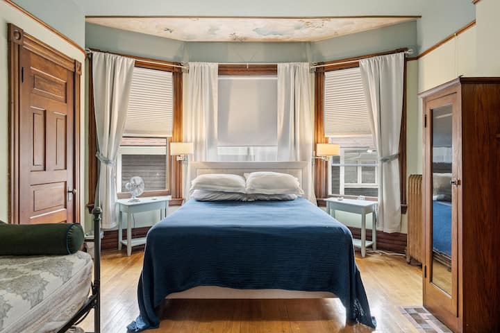 Fireplace bedroom. This fireplace is not functional yet but it is romantic. Queen sized bed in this room as well as a twin day bed. In summer this bedroom has a window AC unit