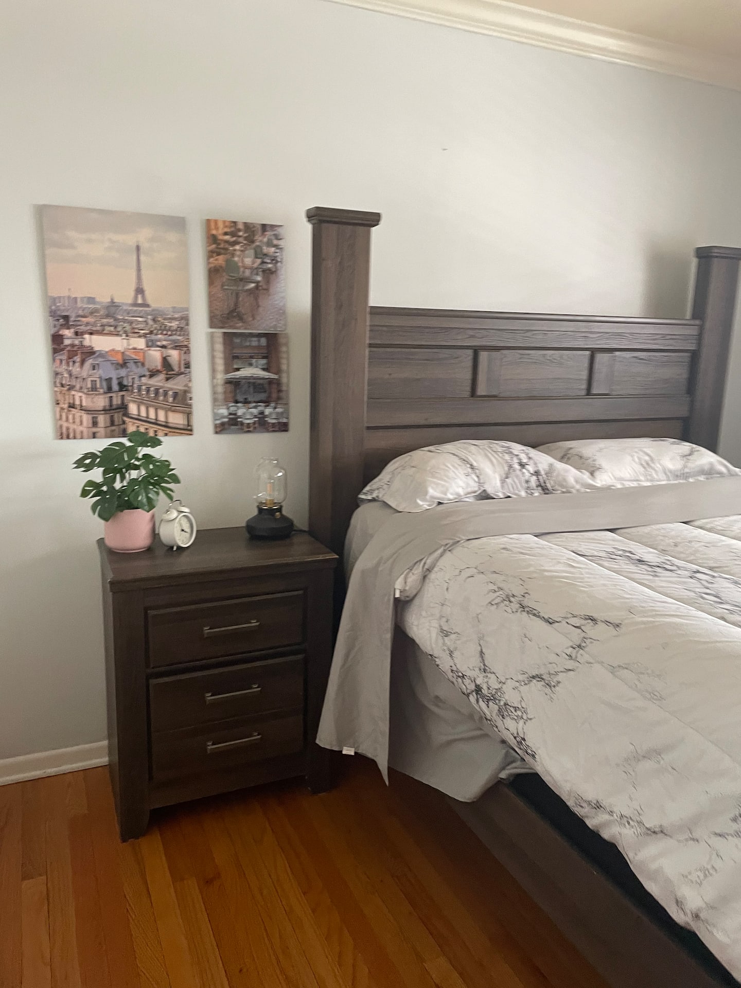 A serene bedroom with a queen-size bed, soft linens, and a view of the garden.