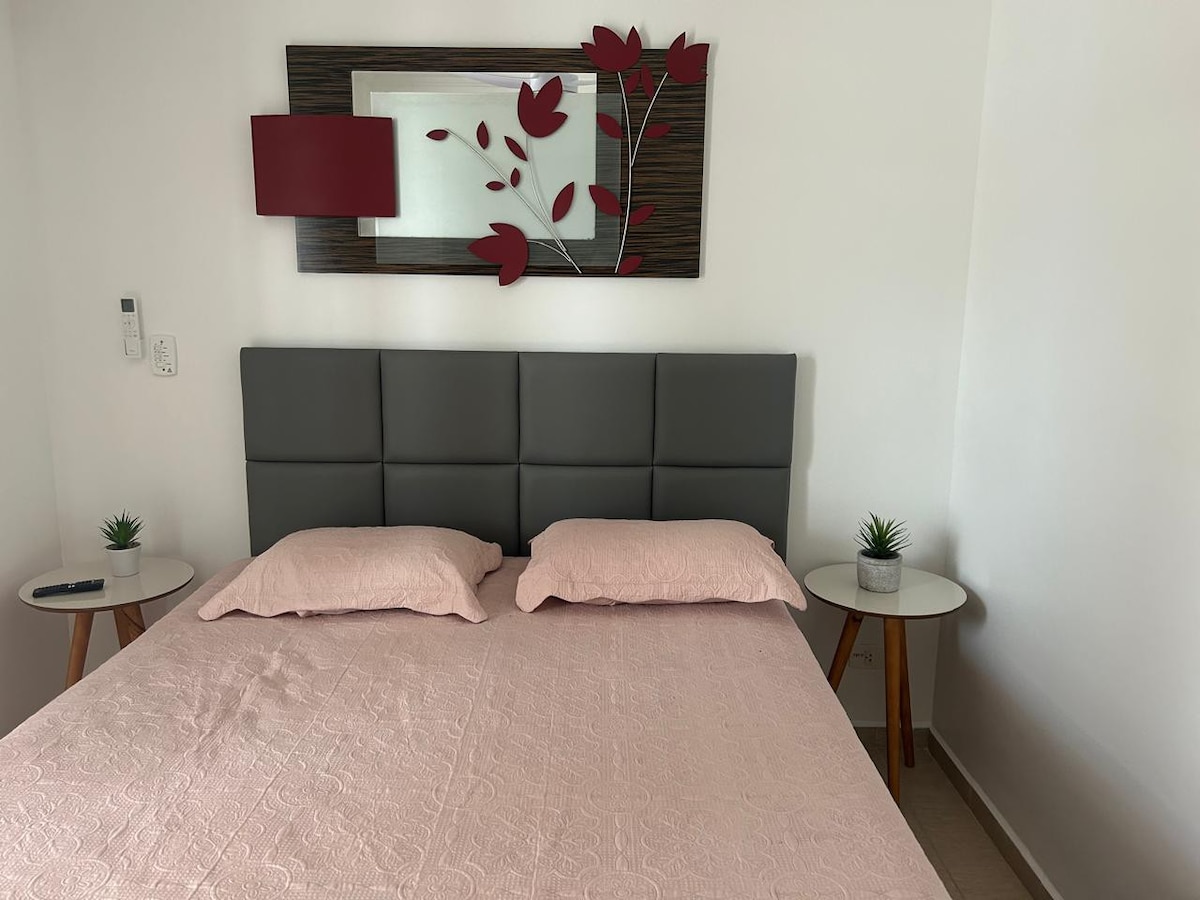 Suite with bed and smart TV