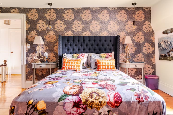 BEDROOM 3 aka THE DRAGON ROOM: This spacious room (queen bed) with walls festooned with dragons is a nice surprise.  Quality linens and a comfortable bed promise a gorgeous sleep. The room's ensuite bathroom is yours to enjoy!