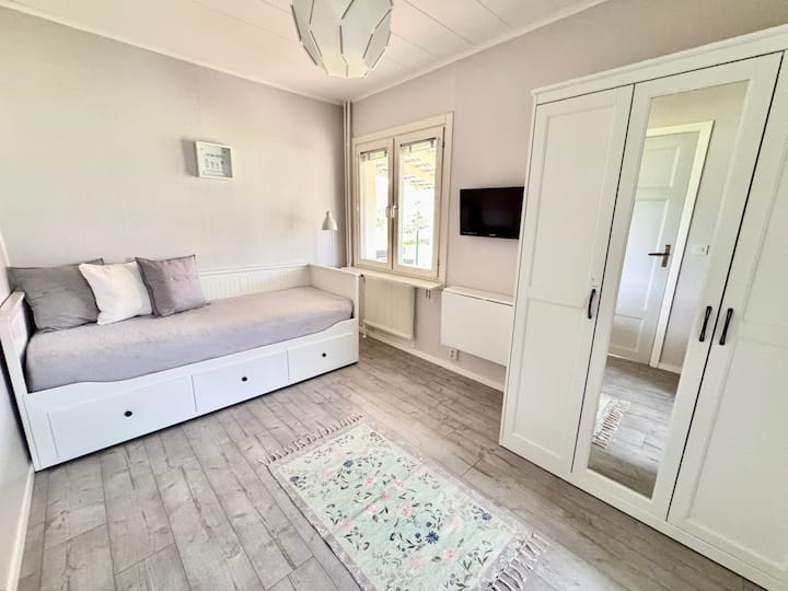 Bedroom 3 is downstairs. There is a fold-out writing desk and a TV/DVD player. The daybed expands to a double.