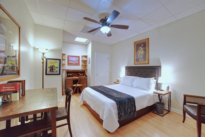 Queen Bedroom #4 sleeps 2 and includes a workspace with desk. Windowless—ideal for daytime sleeping.