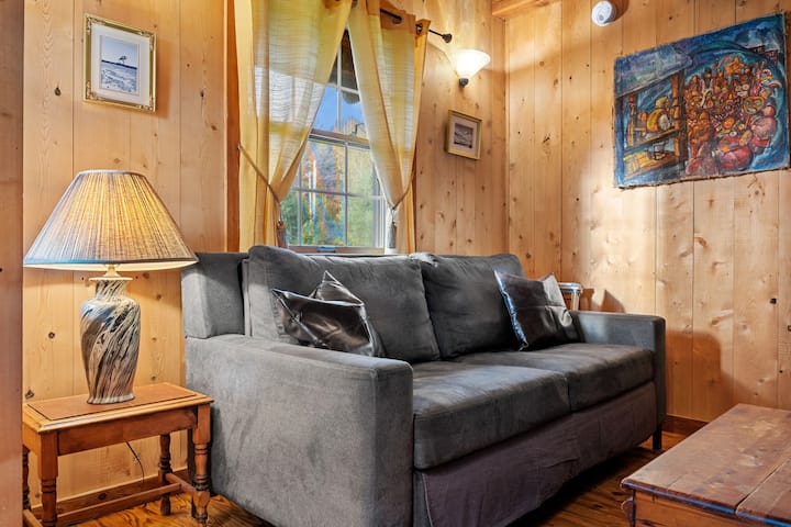 The living room is perfect for relaxing or entertaining, and as a bonus, the couch folds out into an additional queen-size sleeping space. A complete set of clean sheets, blankets, and pillows are located in the trunk!