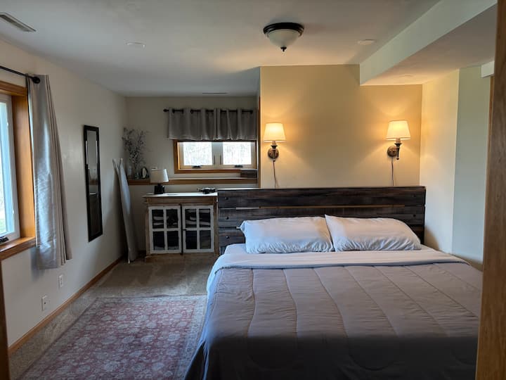 King size bed with Tempur-Pedic mattress, extra pillows available, and reading lamps for a very comfortable night in.