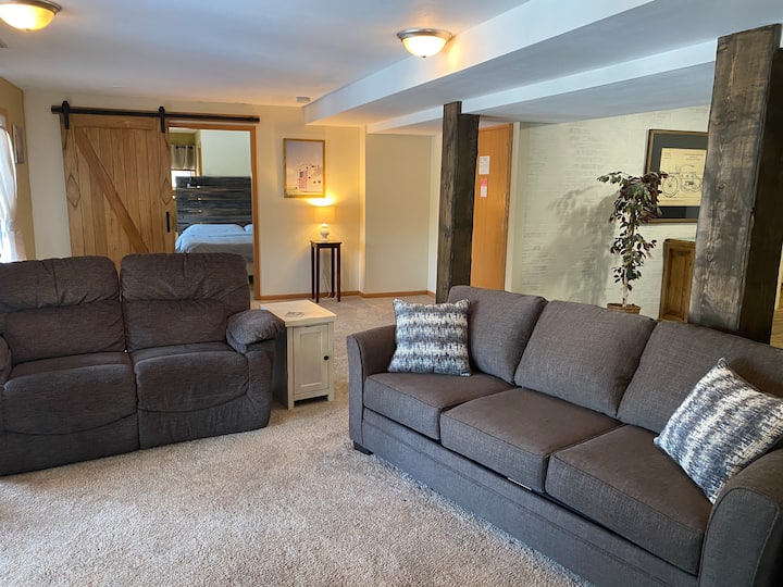 A spacious living room welcomes you to our Garden Suite.  There is plenty of room for four guests to enjoy conversation or play games.  If needed, there is a pull-out sleeper sofa.  Blankets and pillows are in the bedroom cabinet.