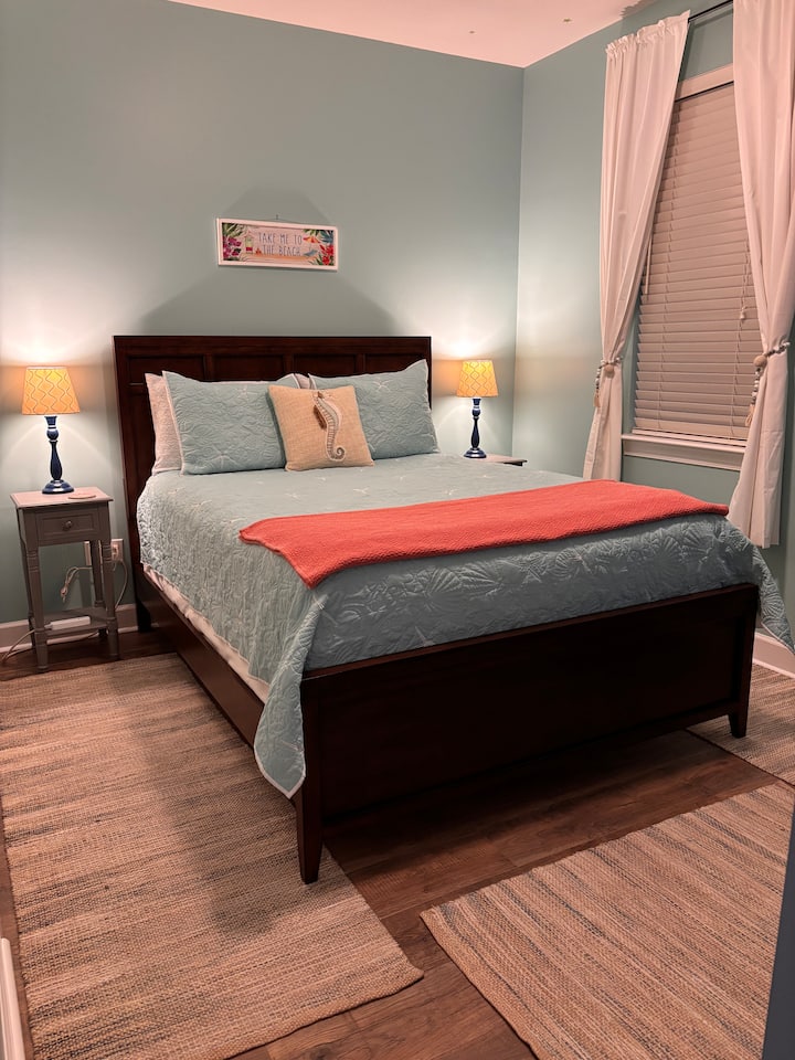 Queen Bed. Bedroom on back side of house. Window looks on fully fenced back yard. Large closet is on left side of bed. 