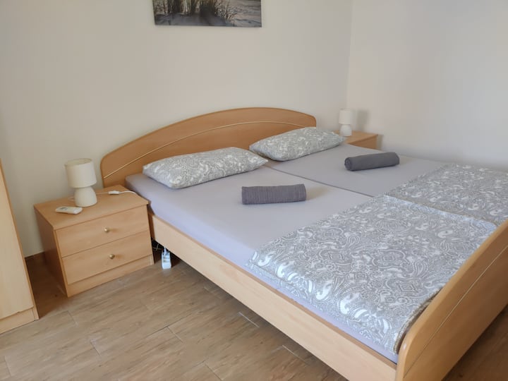 Apartment 2: bedroom with double bed and bedroom with 2 single beds