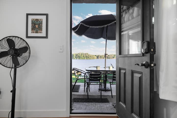 This downstairs bedroom has a private door that leads to patio, with lake view. The door has a built in blind for comfort and privacy or leave it open to maximize lake views. 