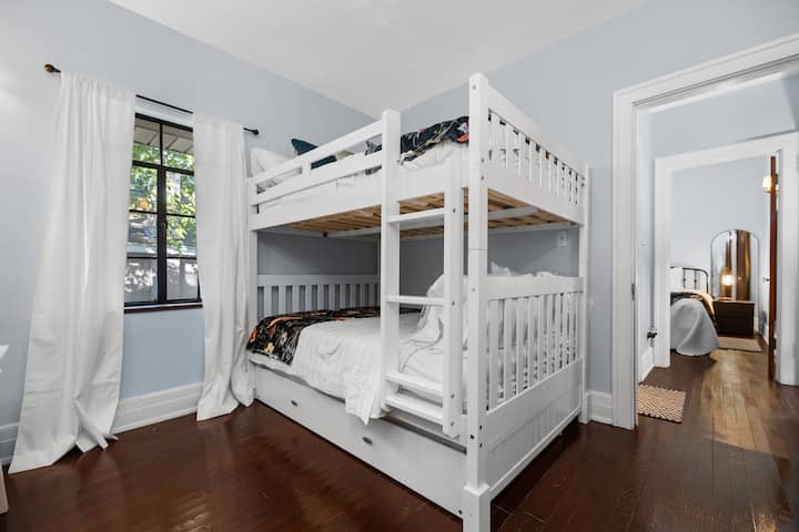Triple bunk bed. Full over full with additional hidden twin trundle pullout. 