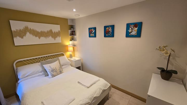 Double bed on lower ground floor with direct access into the walled garden.  Shared shower room next door.