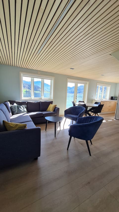 Top performing Airbnb: Unique cozy seaside cabin with beach and a view in Suldal