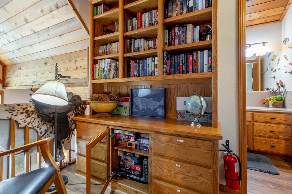 We are retired educators, so an array of books is a must--first readers, developing readers, novels, bios.  The drawers and loaded with games and puzzles--for kids and adults.