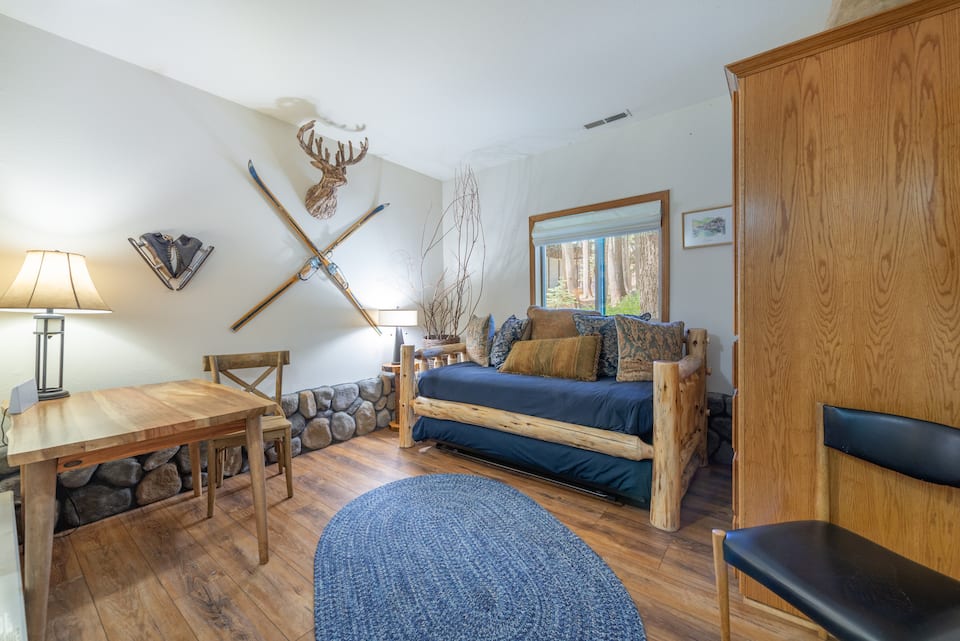 Ground floor bonus bedroom with log daybed and desk